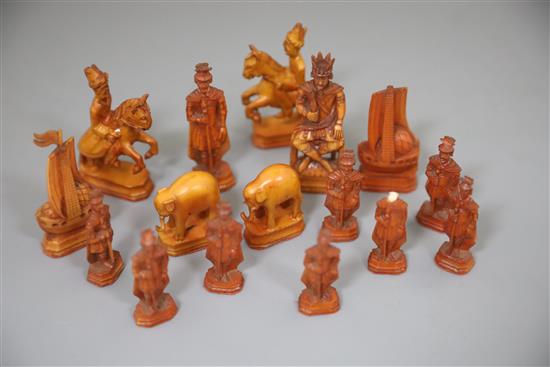 A rare 18th century white and brown walrus ivory Russian chess set, featuring Russians against Persians, in mahogany box,